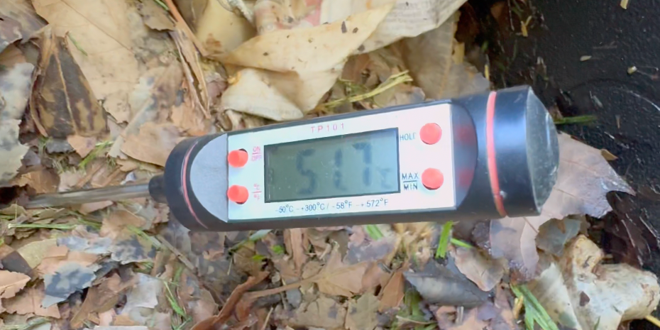 Thermometer reading the temperature of compost inside Bioverter